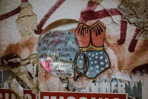 Colorful Wonder Woman graffiti with an inspiring message on a wall in Cologne, Germany. jigsaw puzzle