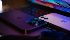 Close-up image of two modern smartphones placed on a laptop keyboard, highlighting technology design. jigsaw puzzle