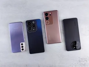 Top view of four colorful smartphones laid out on a white background, showcasing modern technology. jigsaw puzzle