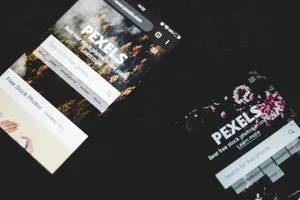 Close-up of smartphones displaying Pexels stock photo website, showcasing modern technology. jigsaw puzzle