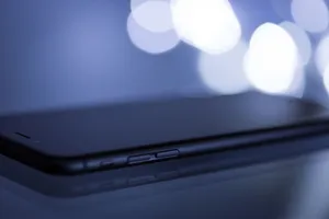 Close-up shot of a sleek smartphone with a blurred bokeh background, emphasizing its modern design. jigsaw puzzle