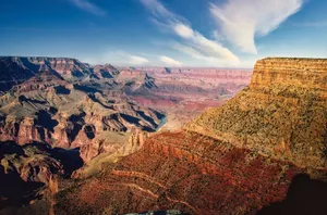Stunning aerial perspective of the majestic Grand Canyon under a clear blue sky. jigsaw puzzle