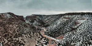 A breathtaking view of a snowy canyon in White Rock, NM, capturing the winter landscape. jigsaw puzzle