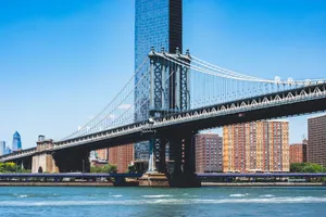 Manhattan Bridge spanning over the East River with New York City skyline in the background. jigsaw puzzle