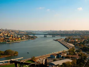 Aerial view of Istanbul showcasing its iconic bridges over the Golden Horn on a clear day. jigsaw puzzle