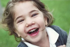 Cheerful child smiling brightly outdoors in Key Biscayne, Florida. Captures happiness and youthful joy. jigsaw puzzle