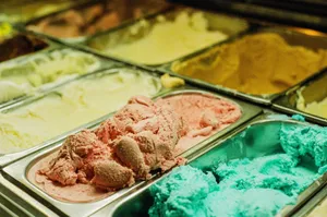 Close-up of various ice cream flavors in a shop freezer, perfect for summer treats. jigsaw puzzle