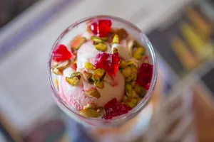 Indulge in this sweet dessert with pistachios and jelly toppings, perfect for a tasteful delight. jigsaw puzzle