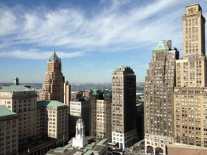 Skyline of Brooklyn, NY featuring iconic historic skyscrapers against a clear sky. jigsaw puzzle