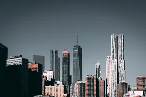 Stunning view of New York City's skyline with iconic skyscrapers under a clear sky. jigsaw puzzle