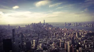 Stunning aerial view of New York City skyline with the Hudson River at dusk, highlighting iconic skyscrapers and urban landscape. jigsaw puzzle