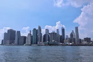 Beautiful view of Manhattan's skyline with a clear blue sky, showcasing modern architecture. jigsaw puzzle
