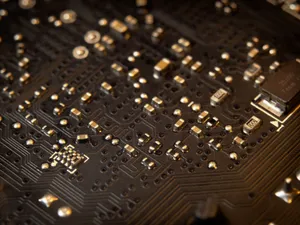 Detailed view of a circuit board showing various electronic components and traces. jigsaw puzzle