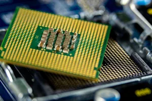 Detailed close-up of a microprocessor on a motherboard showcasing its intricate design. jigsaw puzzle