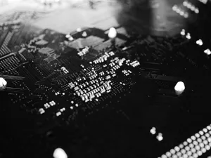 Black and white close-up of a circuit board with intricate patterns and components. jigsaw puzzle