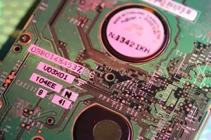 Detailed close-up of a computer circuit board highlighting components and electronic paths. jigsaw puzzle