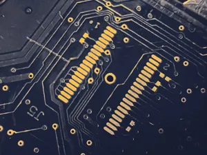 Detailed view of a modern electronic circuit board showing intricate pathways and components. jigsaw puzzle