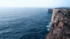 Breathtaking view of rugged cliffs meeting the Atlantic Ocean in Sagres, Portugal. jigsaw puzzle