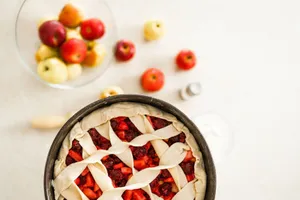 Fresh apple cherry pie ready to bake, paired with colorful apples. jigsaw puzzle