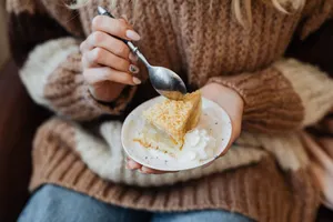 Cozy autumn moment enjoying a slice of apple pie and whipped cream indoors. jigsaw puzzle