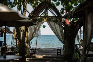 Relaxing beachfront gazebo setting in Bali with ocean views. jigsaw puzzle