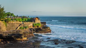 Aerial view of Tanah Lot Temple in Bali, surrounded by beautiful rocky shores and ocean waves. jigsaw puzzle