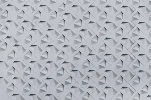 Textured wall showcasing a geometric 3D pattern in monochrome tones, perfect for architectural inspiration. jigsaw puzzle