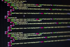 Detailed close-up of HTML code on a computer monitor, showcasing web development. jigsaw puzzle