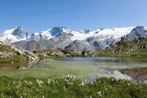 Breathtaking view of snowcapped peaks and clear lake in La Grave, France. jigsaw puzzle
