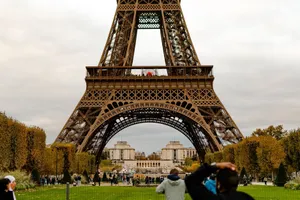 Capture of the Eiffel Tower surrounded by autumn foliage, a popular Paris landmark. jigsaw puzzle