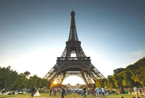 Tourists enjoy a sunny day at the Eiffel Tower in Paris, France. jigsaw puzzle