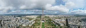 Stunning aerial view of the Eiffel Tower in Paris, capturing the city skyline on a cloudy day. jigsaw puzzle