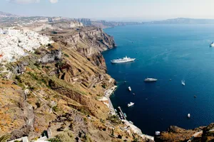 A breathtaking aerial view of Thera, Greece with its iconic cliffs and the serene Aegean Sea. jigsaw puzzle
