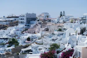 Beautiful view of iconic white buildings in a Santorini village overlooking the sea. jigsaw puzzle