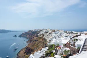 Picturesque view of Santorini's white architecture along the blue Aegean Sea. jigsaw puzzle