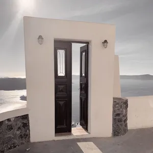 A classic Santorini doorway opens to reveal a stunning sea view, capturing Greece's tranquil beauty. jigsaw puzzle
