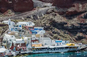 Picturesque harbor scene with traditional architecture in Santorini, Greece. jigsaw puzzle