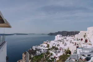 Breathtaking panoramic view of Santorini's iconic white buildings overlooking the Aegean Sea. jigsaw puzzle