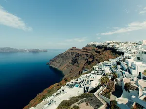 Stunning view of the Santorini coastline with iconic white buildings and deep blue sea. jigsaw puzzle