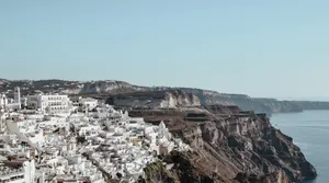 Explore the stunning cliffside architecture of Fira, Santorini with breathtaking coastal vistas. jigsaw puzzle