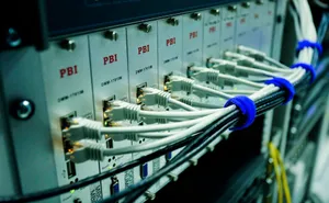 Close-up of ethernet cables connected to a network switch panel in a data center. jigsaw puzzle