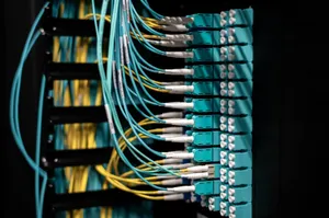 Closeup of switch in server with connectors and adapters connected to plastic device in dark room on blurred background inside jigsaw puzzle