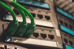 Close-up of green network cables plugged into server ports, showcasing technology setup. jigsaw puzzle