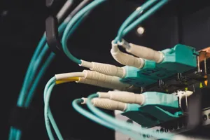 Detailed view of fiber optic cables and ports in a server room, showcasing connectivity. jigsaw puzzle
