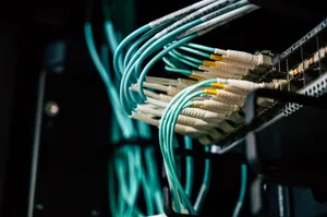 Detailed view of network cables plugged into a server rack in a data center. jigsaw puzzle