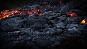 Close-up of glowing lava flowing over dark volcanic rock, showcasing intense heat and dramatic landscapes. jigsaw puzzle