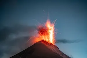 Stunning eruption of Volcán de Fuego in Guatemala, captured with dramatic sparks and lava in the night sky. jigsaw puzzle