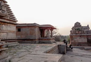 Explore the historical architecture of Hampi's ancient temples in Karnataka, India at sunset. jigsaw puzzle