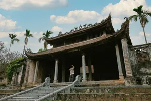 Beautiful Vietnamese temple with intricate architecture and palm trees in Hanoi, Vietnam. jigsaw puzzle