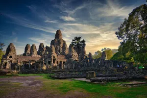 Discover the ancient Bayon Temple in Cambodia, captured at sunset with dramatic skies. jigsaw puzzle